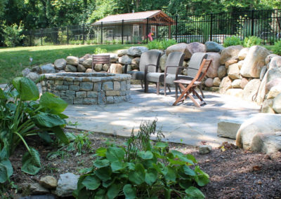 Expertly-landscaped LawnScapes outdoor project with decorative plants and stonework.