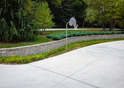 Expertly-landscaped LawnScapes outdoor project with decorative plants and stonework.