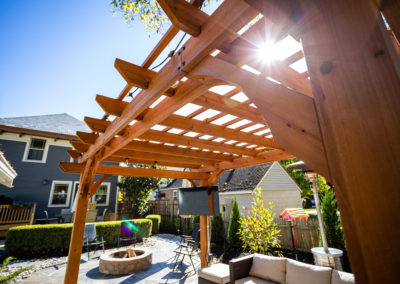Expertly-landscaped LawnScapes outdoor project with decorative plants and stonework.