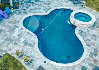 Expertly-landscaped LawnScapes outdoor project with decorative plants and stonework.