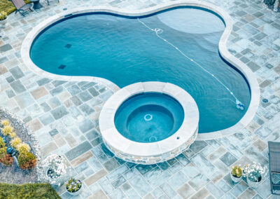 Expertly-landscaped LawnScapes outdoor project with decorative plants and stonework.