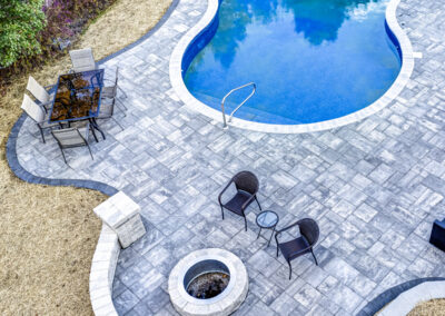 Expertly-landscaped LawnScapes outdoor project with decorative plants and stonework.