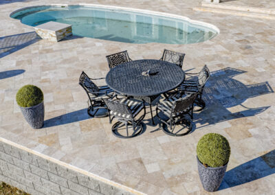 Expertly-landscaped LawnScapes outdoor project with decorative plants and stonework.