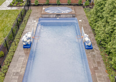 Expertly-landscaped LawnScapes outdoor project with decorative plants and stonework.