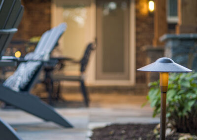 Expertly-landscaped LawnScapes outdoor project with decorative plants and stonework.