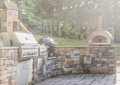 Expertly-landscaped LawnScapes outdoor project with decorative plants and stonework.