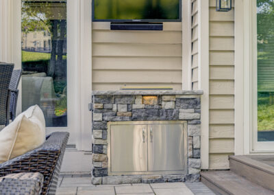 Expertly-landscaped LawnScapes outdoor project with decorative plants and stonework.