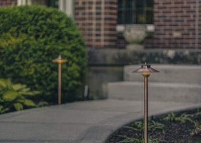 Expertly-landscaped LawnScapes outdoor project with decorative plants and stonework.