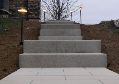 Expertly-landscaped LawnScapes outdoor project with decorative plants and stonework.
