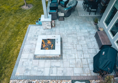 Expertly-landscaped LawnScapes outdoor project with decorative plants and stonework.