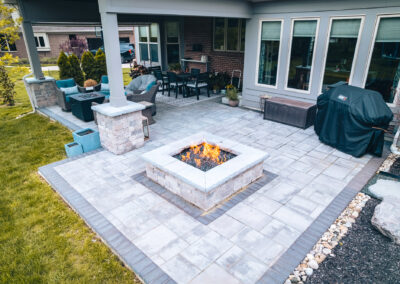Expertly-landscaped LawnScapes outdoor project with decorative plants and stonework.