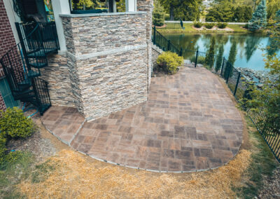 Expertly-landscaped LawnScapes outdoor project with decorative plants and stonework.