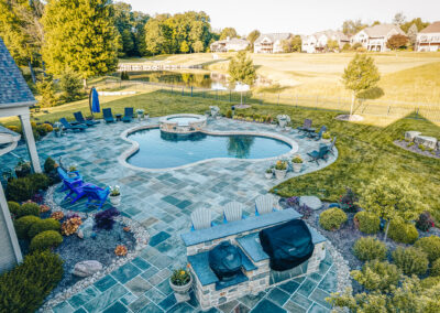Expertly-landscaped LawnScapes outdoor project with decorative plants and stonework.