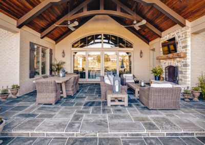 Expertly-landscaped LawnScapes outdoor project with decorative plants and stonework.