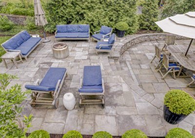 Expertly-landscaped LawnScapes outdoor project with decorative plants and stonework.