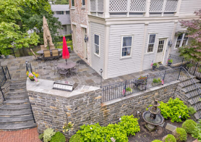 Expertly-landscaped LawnScapes outdoor project with decorative plants and stonework.