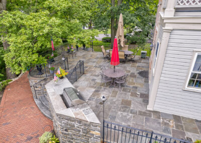 Expertly-landscaped LawnScapes outdoor project with decorative plants and stonework.