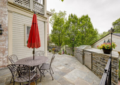 Expertly-landscaped LawnScapes outdoor project with decorative plants and stonework.