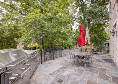 Expertly-landscaped LawnScapes outdoor project with decorative plants and stonework.