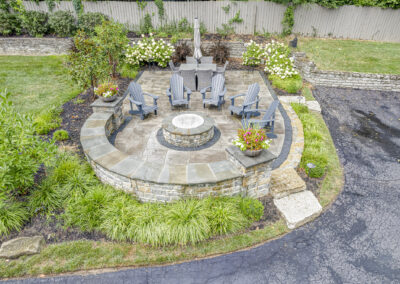 Expertly-landscaped LawnScapes outdoor project with decorative plants and stonework.