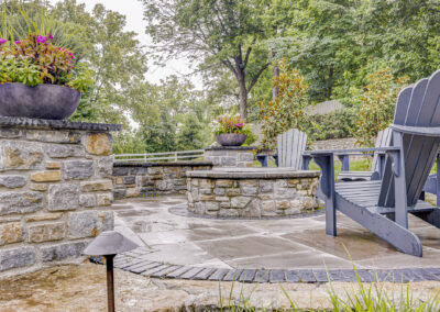 Expertly-landscaped LawnScapes outdoor project with decorative plants and stonework.