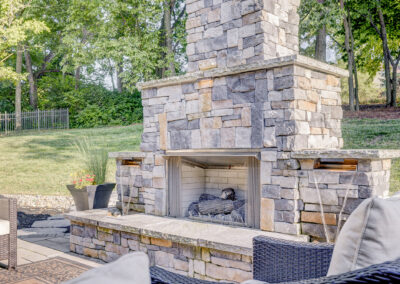 Expertly-landscaped LawnScapes outdoor project with decorative plants and stonework.
