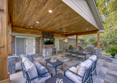 Expertly-landscaped LawnScapes outdoor project with decorative plants and stonework.