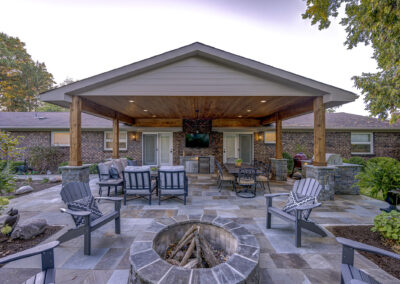 Expertly-landscaped LawnScapes outdoor project with decorative plants and stonework.