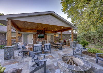 Expertly-landscaped LawnScapes outdoor project with decorative plants and stonework.