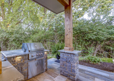 Expertly-landscaped LawnScapes outdoor project with decorative plants and stonework.