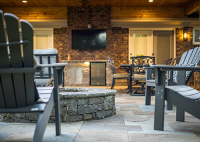 Expertly-landscaped LawnScapes outdoor project with decorative plants and stonework.