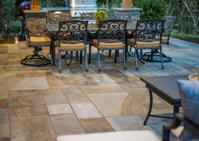 Expertly-landscaped LawnScapes outdoor project with decorative plants and stonework.