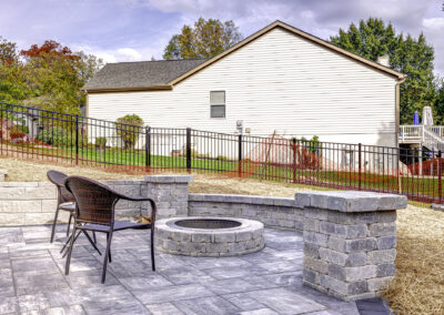 Expertly-landscaped LawnScapes outdoor project with decorative plants and stonework.