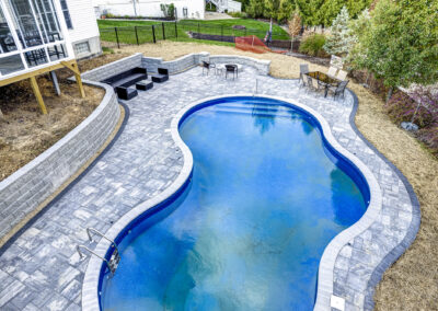 Expertly-landscaped LawnScapes outdoor project with decorative plants and stonework.