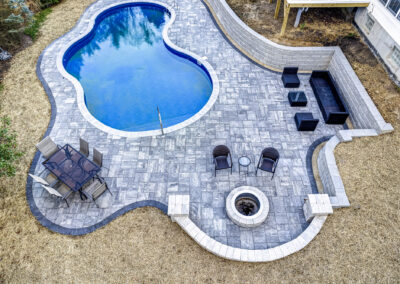 Expertly-landscaped LawnScapes outdoor project with decorative plants and stonework.