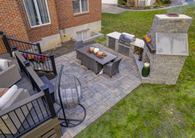 Expertly-landscaped LawnScapes outdoor project with decorative plants and stonework.