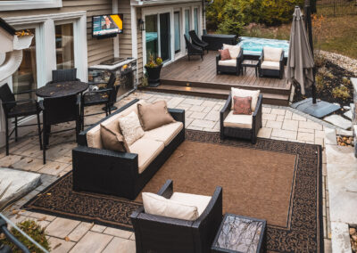 Expertly-landscaped LawnScapes outdoor project with decorative plants and stonework.