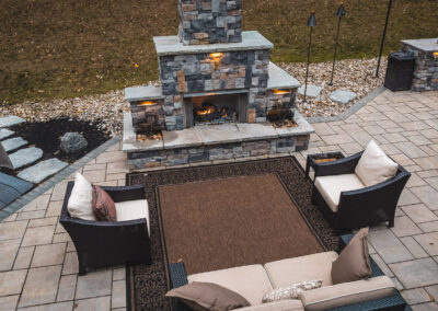 Expertly-landscaped LawnScapes outdoor project with decorative plants and stonework.
