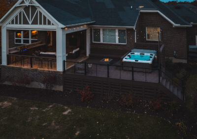 Expertly-landscaped LawnScapes outdoor project with decorative plants and stonework.