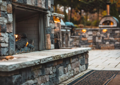 Expertly-landscaped LawnScapes outdoor project with decorative plants and stonework.